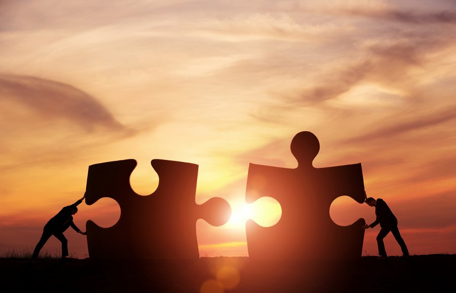 Jigsaw teamwork partnership work together collaborate